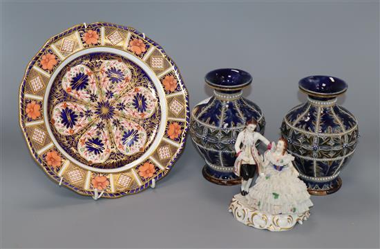 A pair of Doulton vases and a Derby Imari style plate and a Continental porcelain figural group